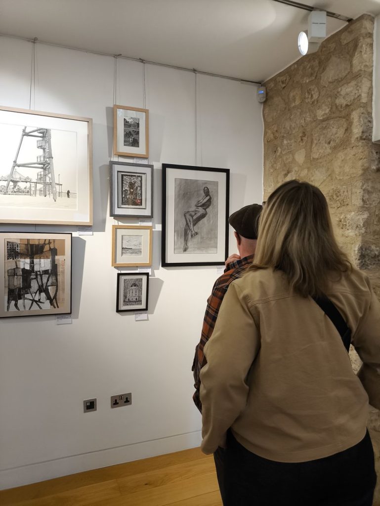 Someone is looking at the charcoal drawing You did what? exhibited at the Oxford art society open exhibition 2026